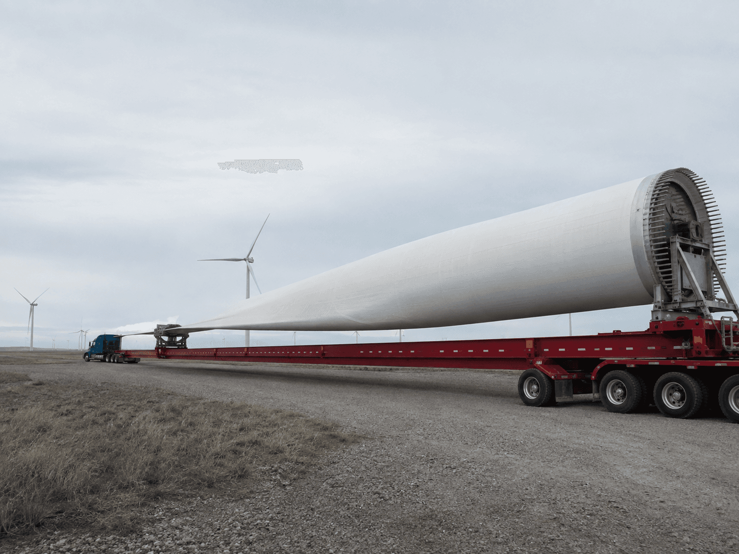 Wind-turbine blade transport showing an extended load